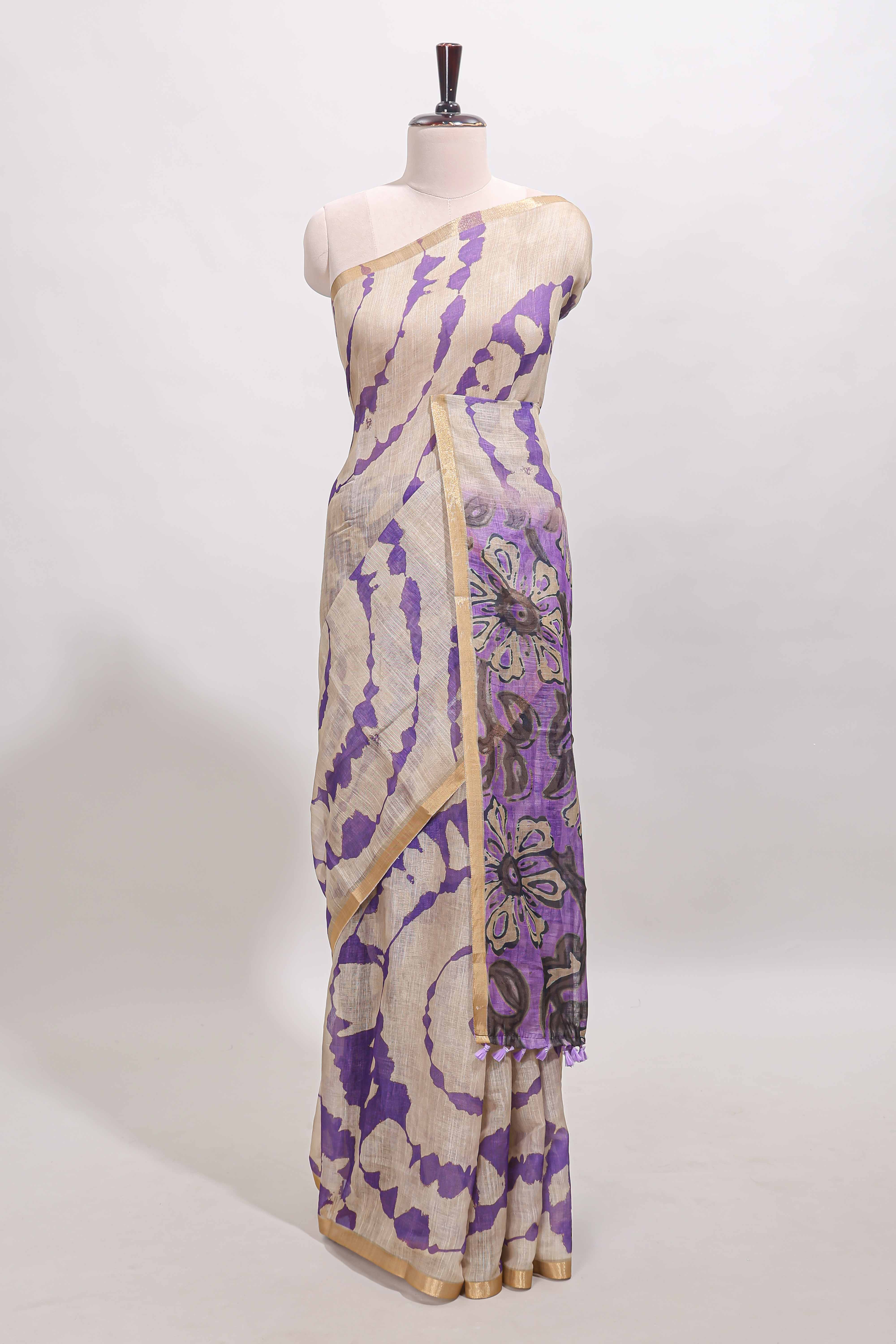 Beige linen cotton saree with violet shibori print, self zari border and floral design pallu