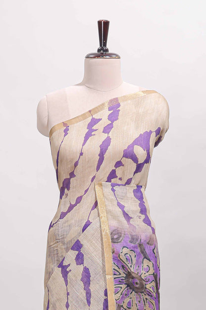 Beige linen cotton saree with violet shibori print, self zari border and floral design pallu
