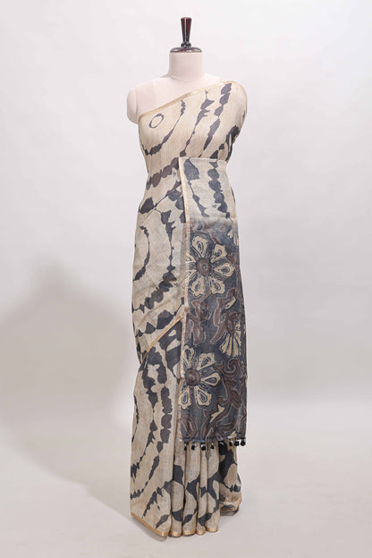 Beige linen cotton saree with grey shibori print, self zari border and floral design pallu