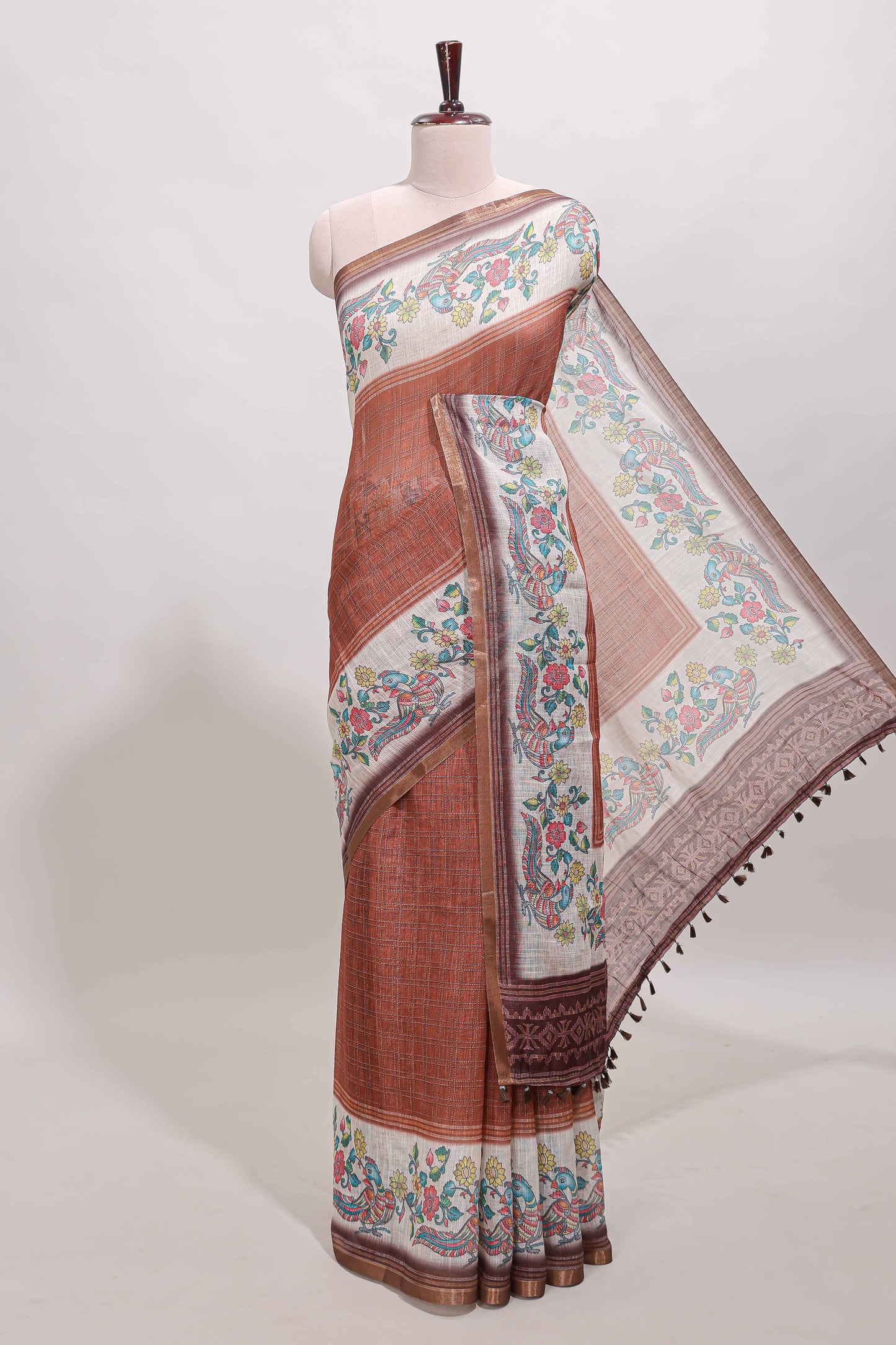 Brown checked linen cotton saree with bottom floral and birds design, self zari border and printed blouse