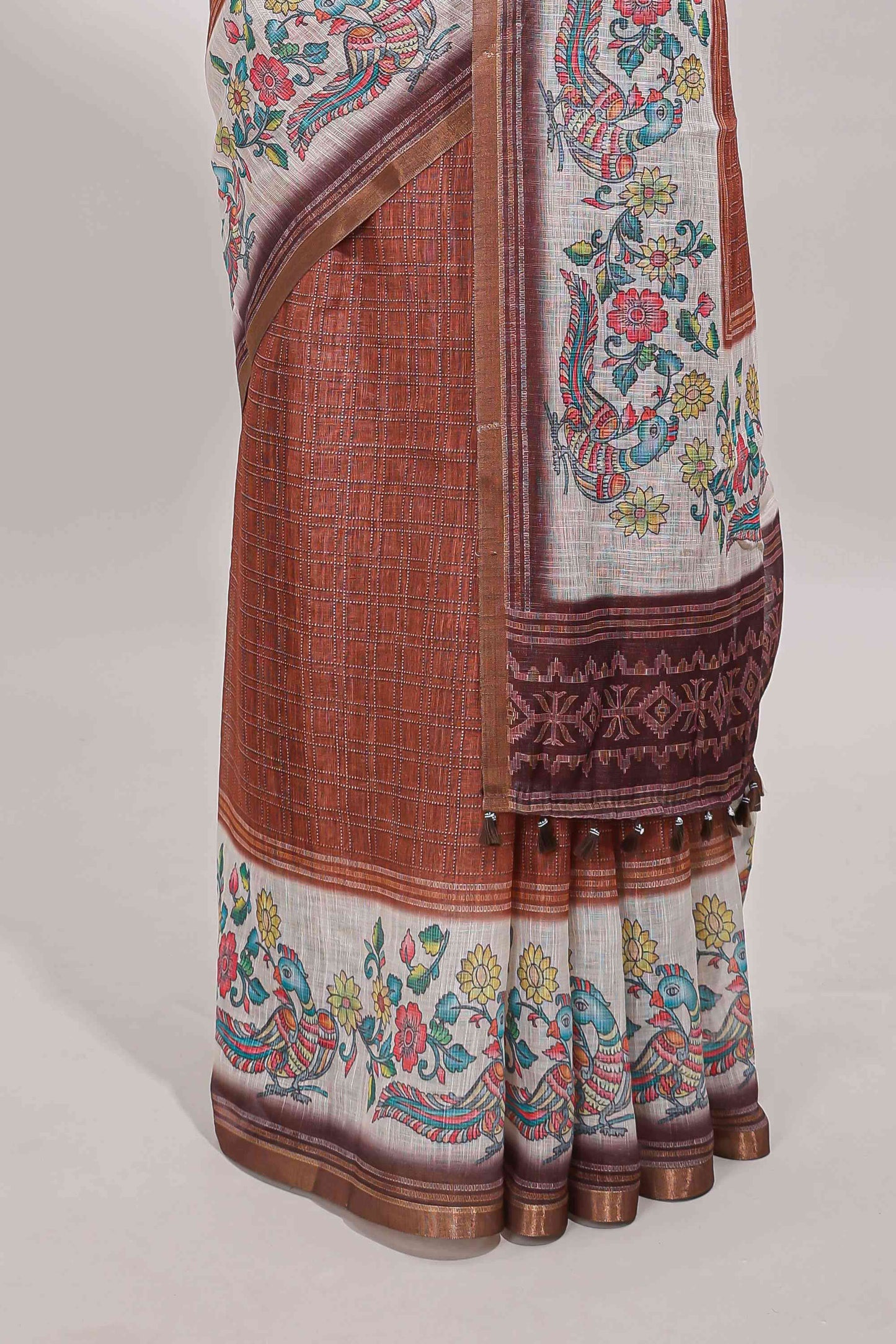 Brown checked linen cotton saree with bottom floral and birds design, self zari border and printed blouse