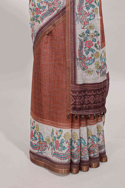 Brown checked linen cotton saree with bottom floral and birds design, self zari border and printed blouse