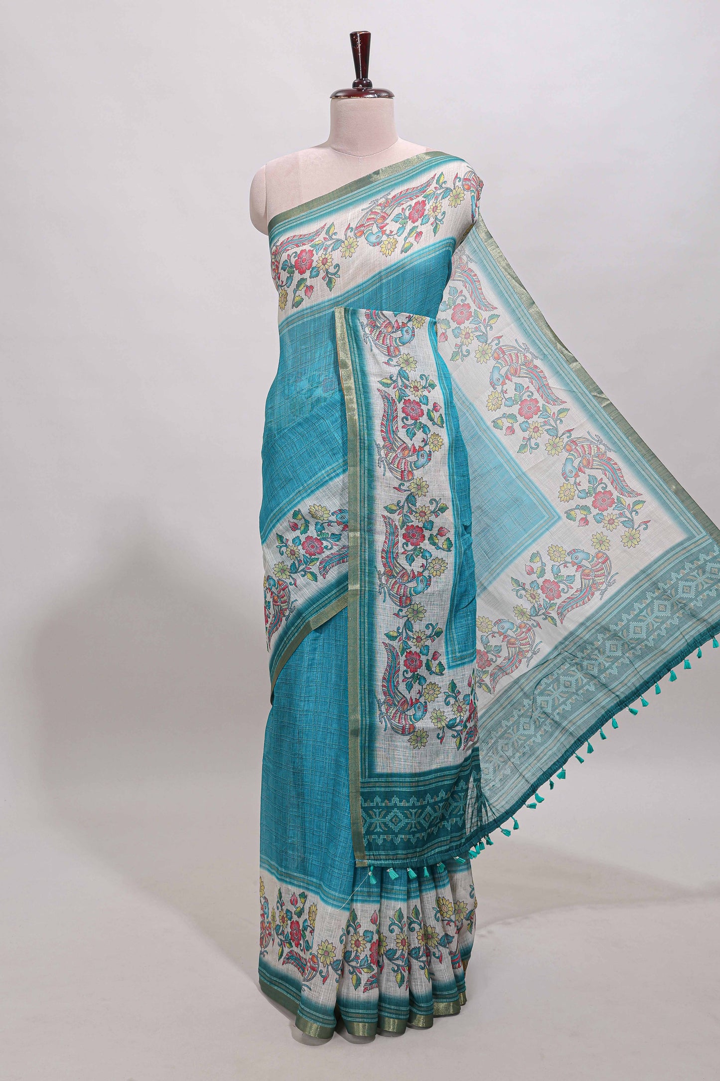 Turquoise green checked linen cotton saree with bottom floral and birds design, self zari border and printed blouse