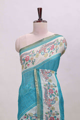 Turquoise green checked linen cotton saree with bottom floral and birds design, self zari border and printed blouse