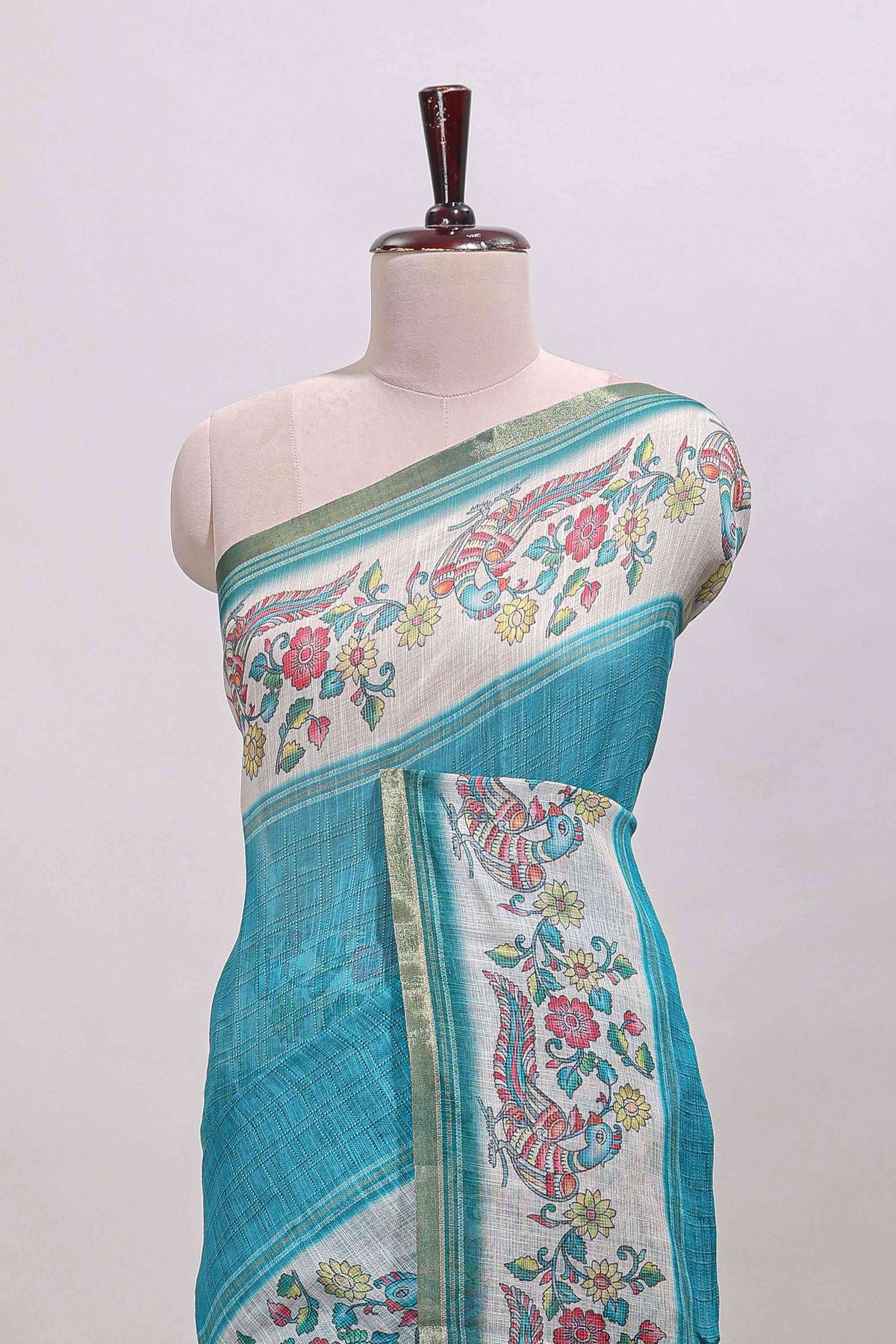 Turquoise green checked linen cotton saree with bottom floral and birds design, self zari border and printed blouse