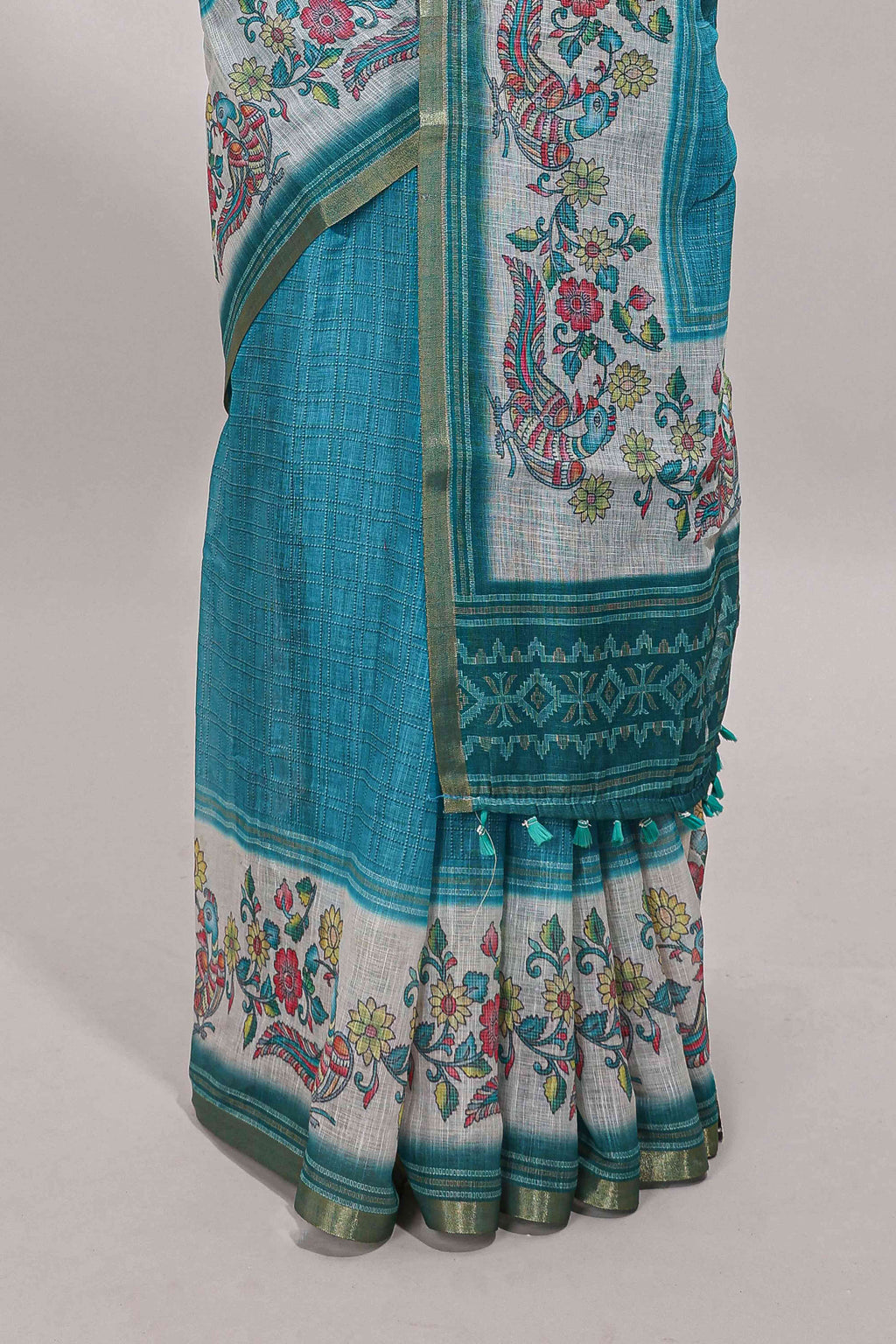 Turquoise green checked linen cotton saree with bottom floral and birds design, self zari border and printed blouse