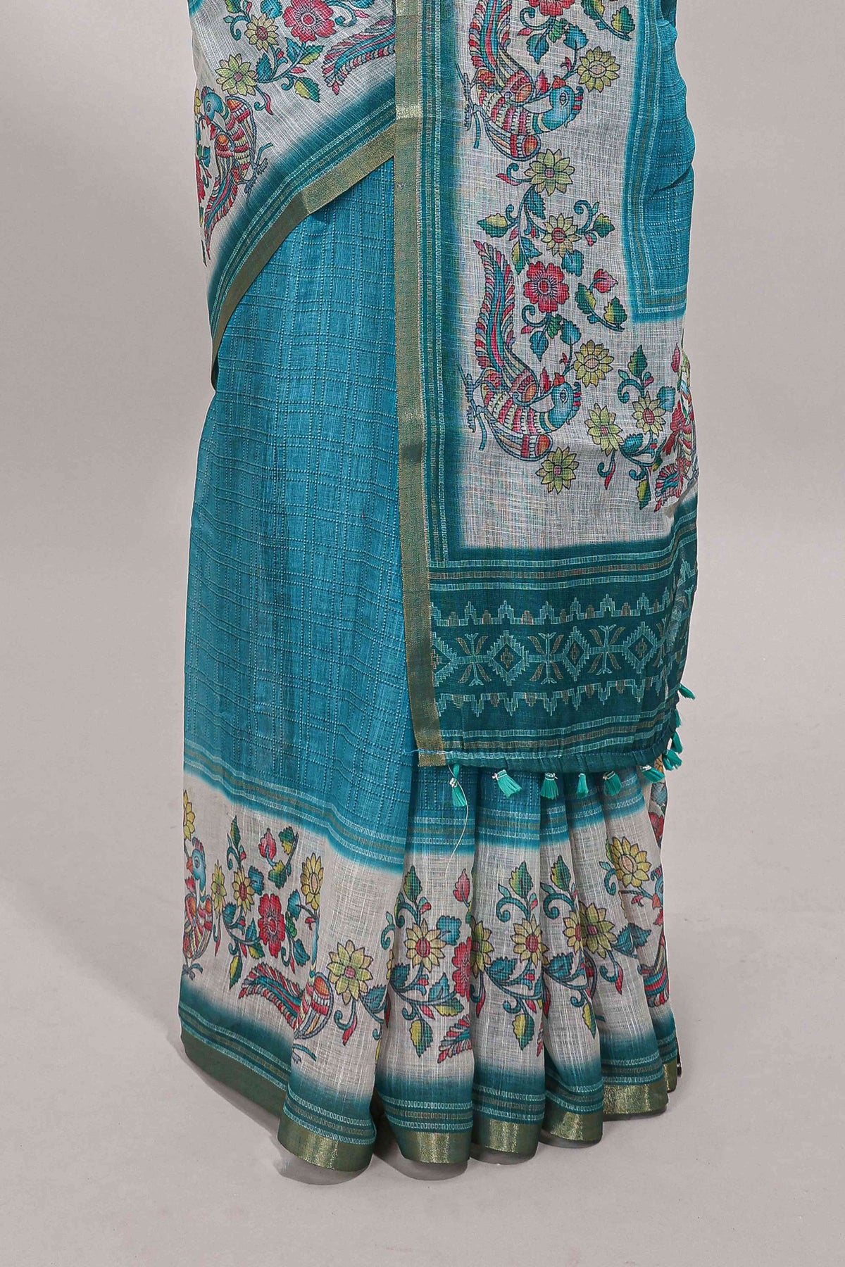 Turquoise green checked linen cotton saree with bottom floral and birds design, self zari border and printed blouse