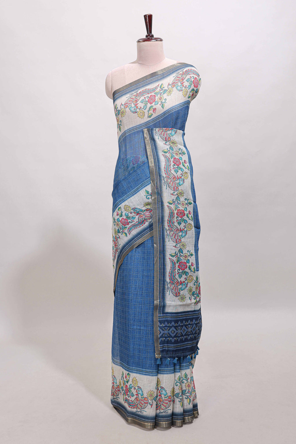 Blue checked linen cotton saree with bottom floral and birds design, self zari border and printed blouse