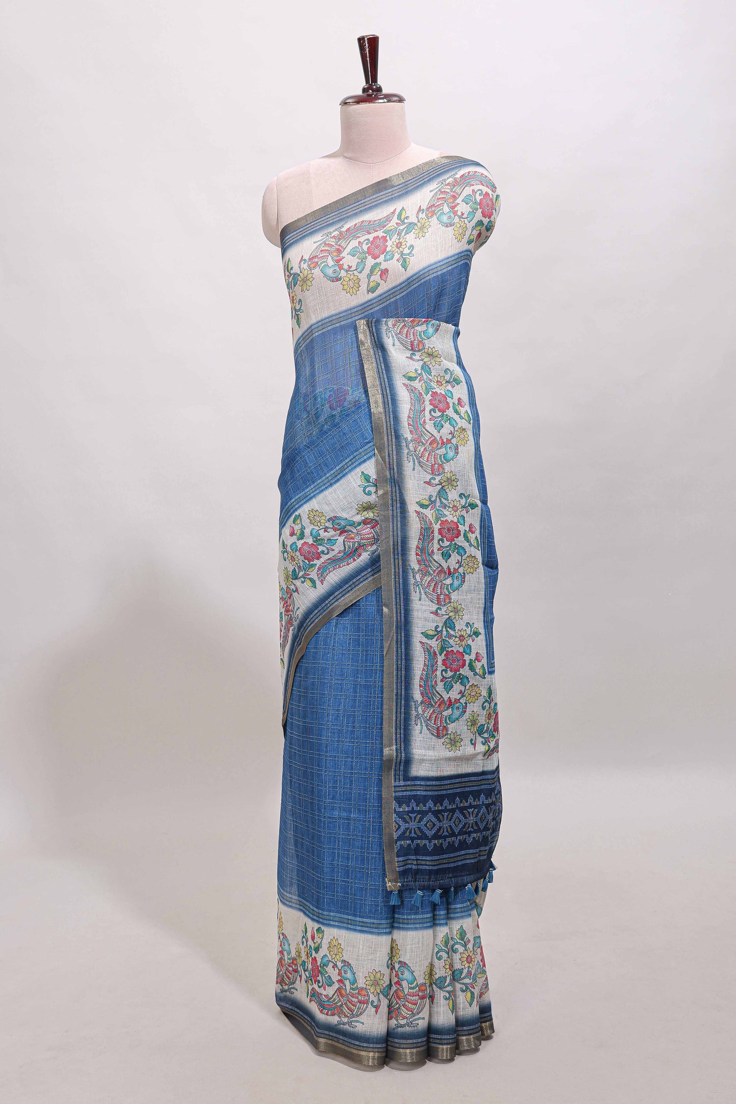 Blue checked linen cotton saree with bottom floral and birds design, self zari border and printed blouse