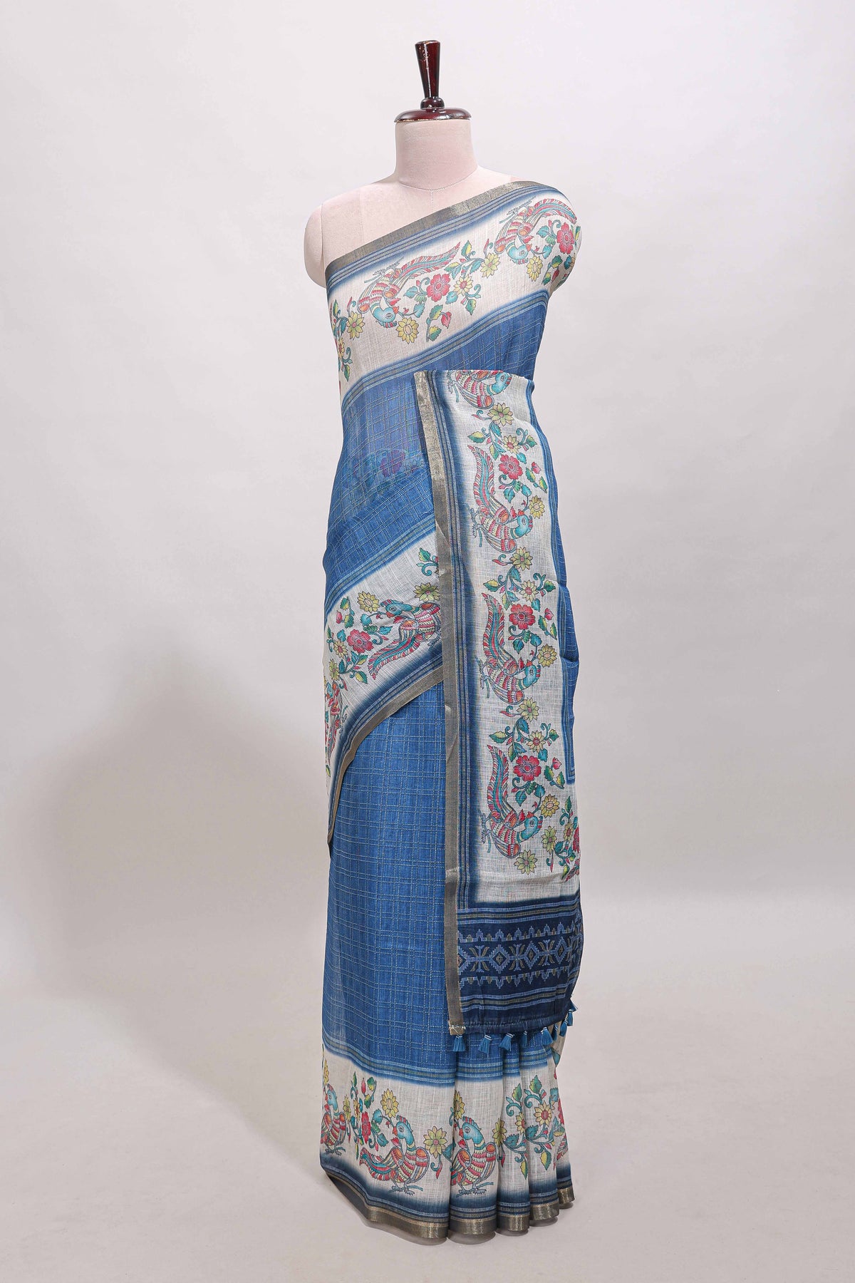 Blue checked linen cotton saree with bottom floral and birds design, self zari border and printed blouse