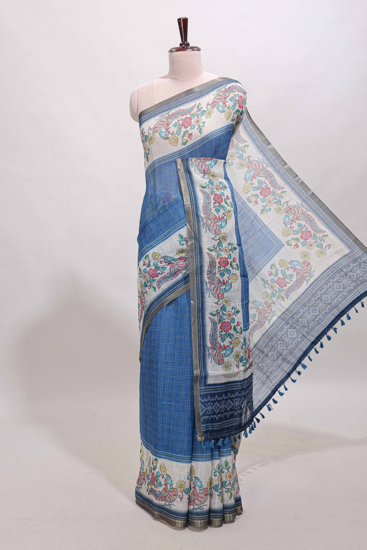 Blue checked linen cotton saree with bottom floral and birds design, self zari border and printed blouse