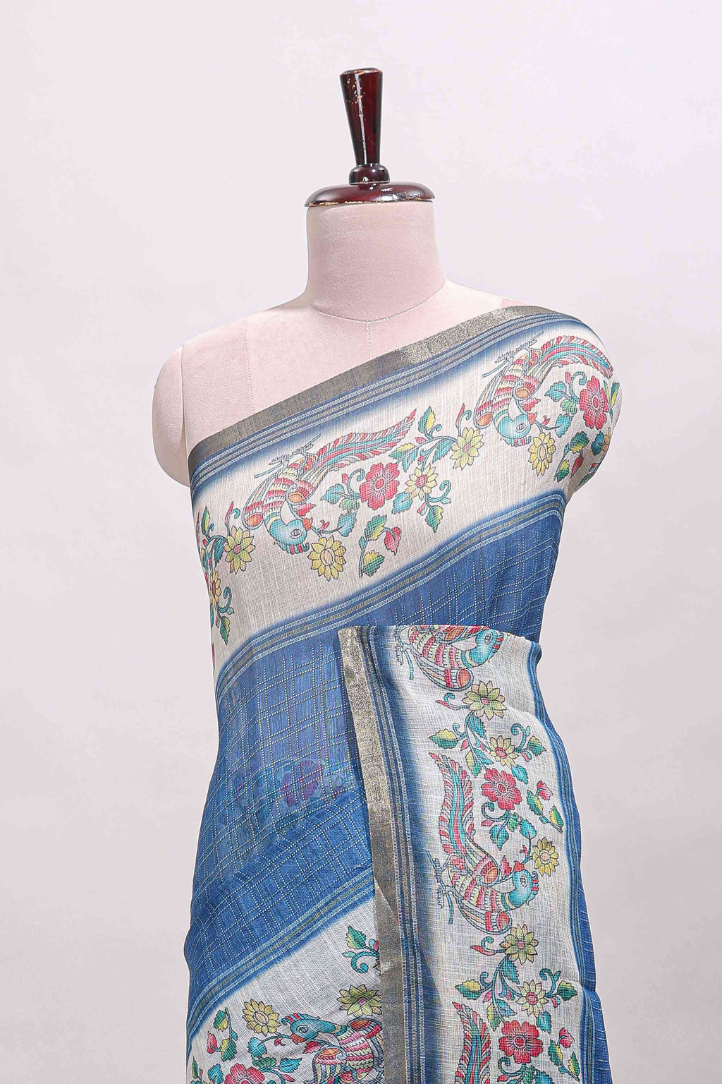 Blue checked linen cotton saree with bottom floral and birds design, self zari border and printed blouse