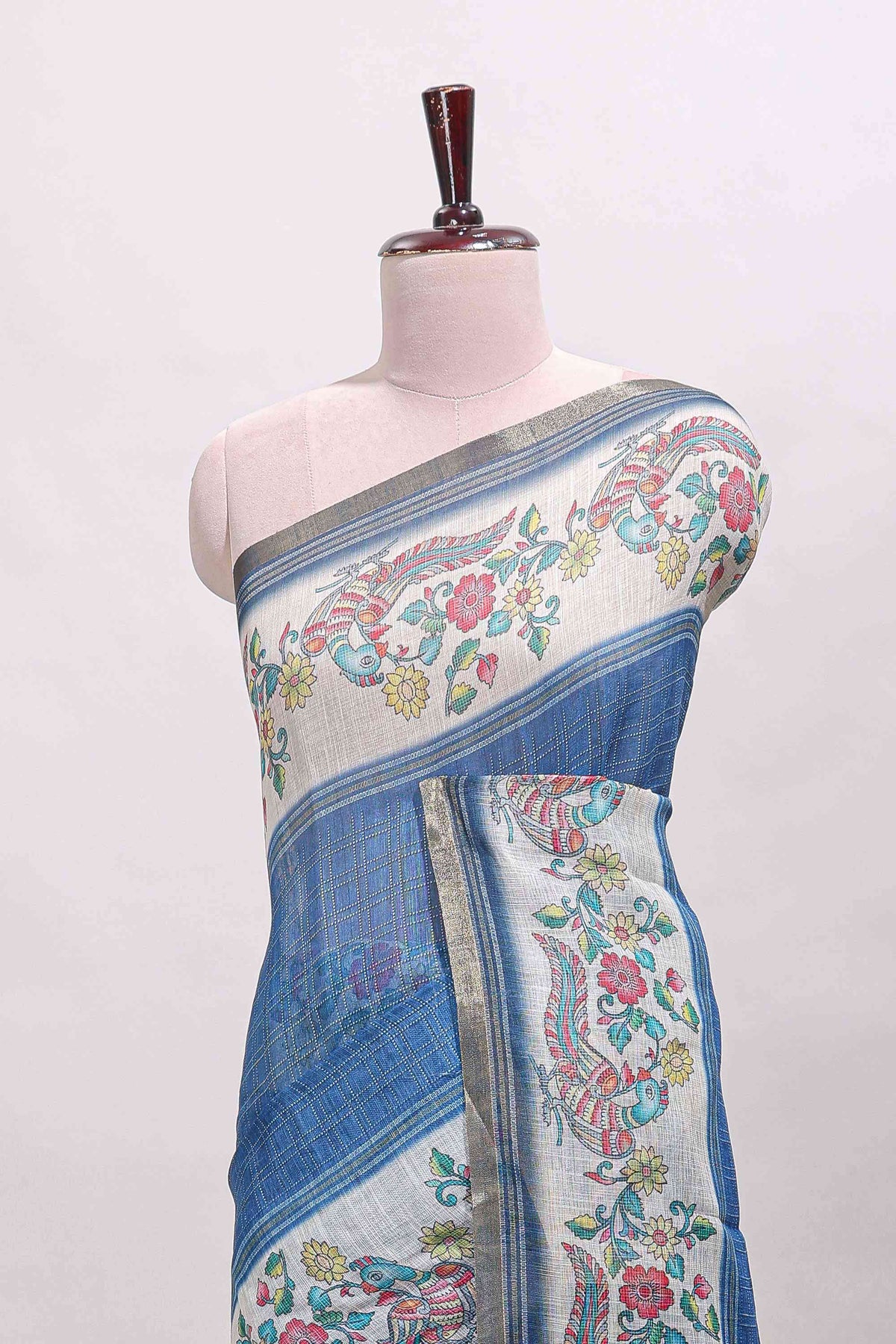 Blue checked linen cotton saree with bottom floral and birds design, self zari border and printed blouse