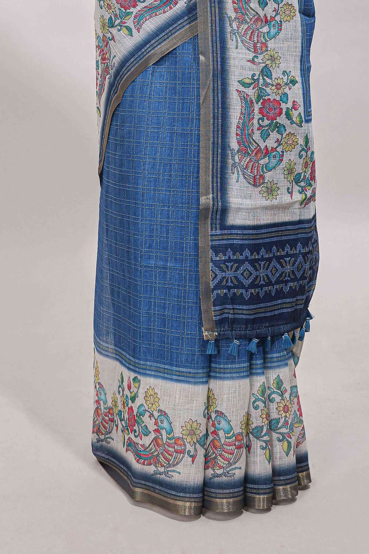 Blue checked linen cotton saree with bottom floral and birds design, self zari border and printed blouse