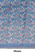 Blue checked linen cotton saree with bottom floral and birds design, self zari border and printed blouse
