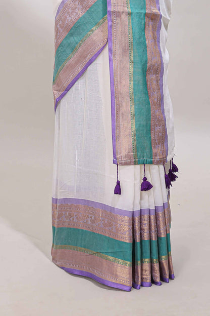 White plain linen cotton saree with contrast zari bentex border & matching pallu with tassels