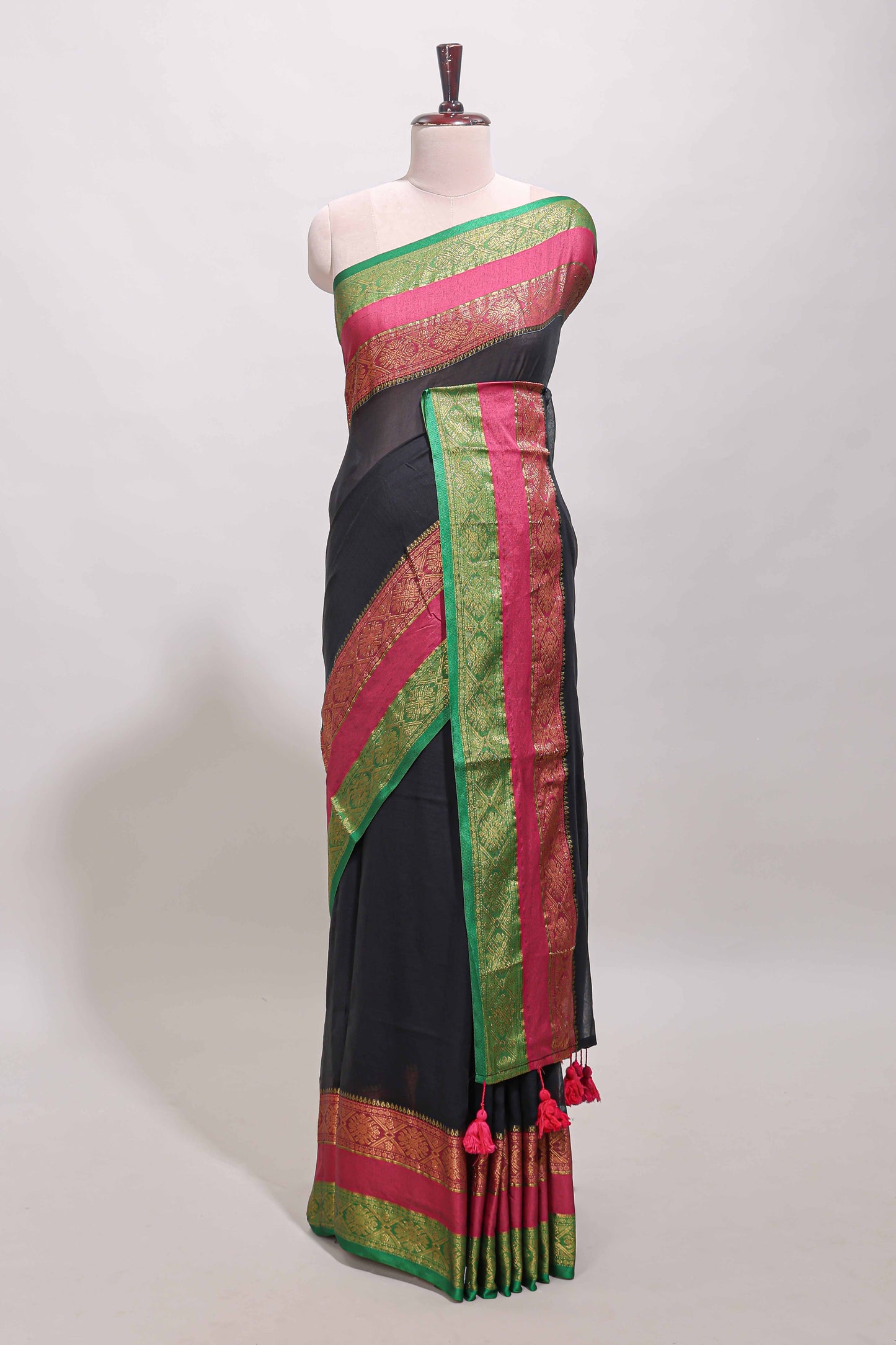 Black plain linen cotton saree with contrast zari bentex border & matching pallu with tassels