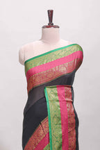 Black plain linen cotton saree with contrast zari bentex border & matching pallu with tassels