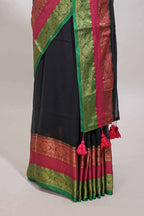 Black plain linen cotton saree with contrast zari bentex border & matching pallu with tassels