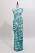 Teal green checked floral motifs linen cotton saree with self zari border matching blouse