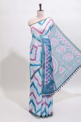 Off white chevron style shibori print linen cotton saree with contrast turquoise blue border and ikkat design pallu