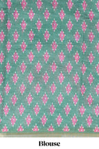 Off white chevron style shibori print linen cotton saree with contrast green border and ikkat design pallu
