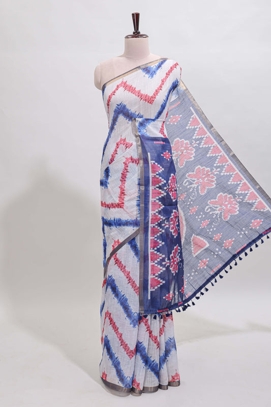 Off white chevron style shibori print linen cotton saree with contrast blue border and ikkat design pallu