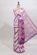 Off white chevron style shibori print linen cotton saree with contrast purple border and ikkat design pallu