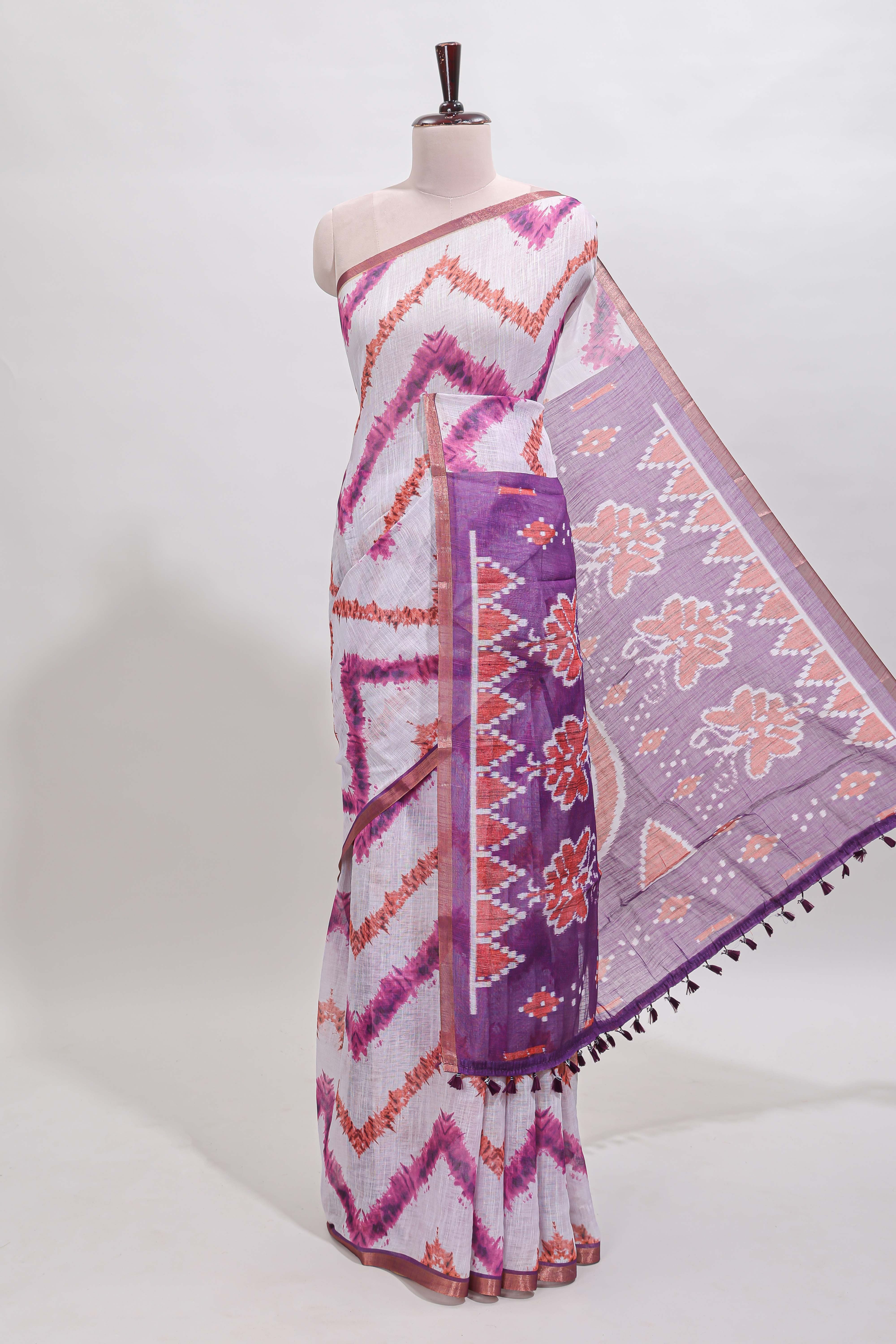 Off white chevron style shibori print linen cotton saree with contrast purple border and ikkat design pallu