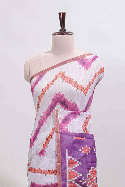 Off white chevron style shibori print linen cotton saree with contrast purple border and ikkat design pallu