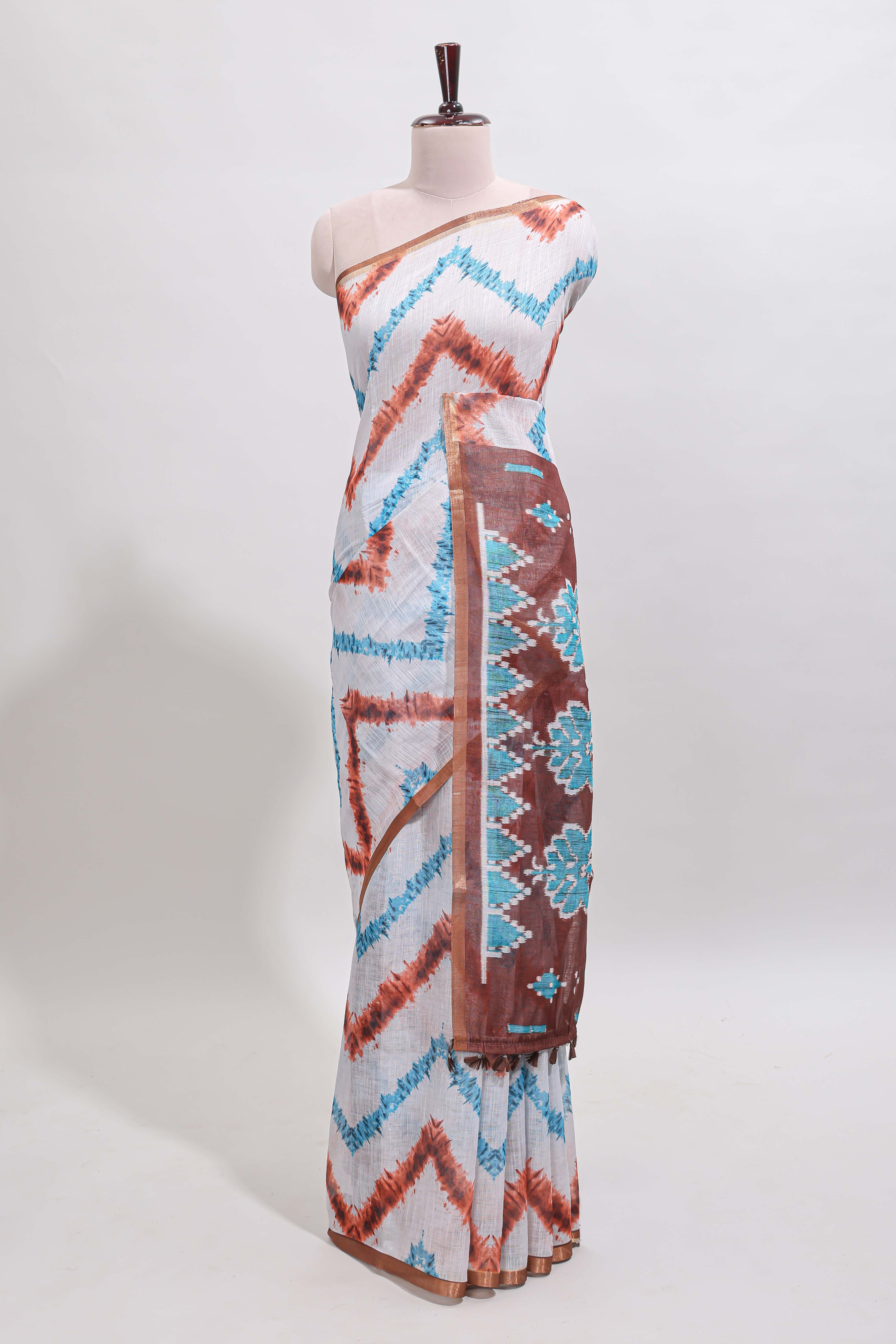 Off white chevron style shibori print linen cotton saree with contrast brown border and ikkat design pallu