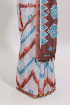 Off white chevron style shibori print linen cotton saree with contrast brown border and ikkat design pallu
