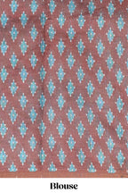 Off white chevron style shibori print linen cotton saree with contrast brown border and ikkat design pallu