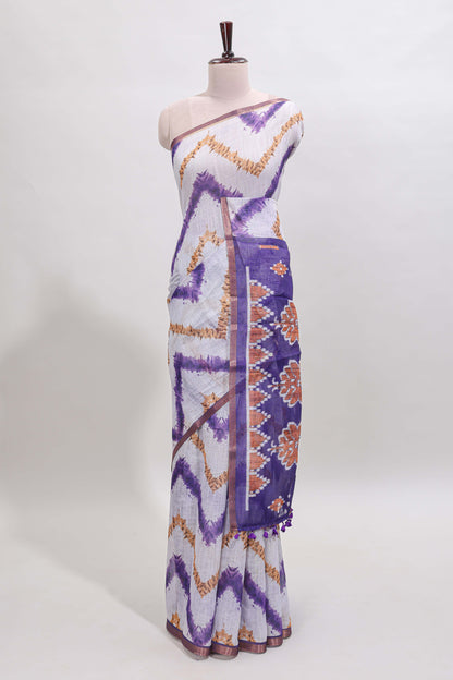 Off white chevron style shibori print linen cotton saree with contrast violet border and ikkat design pallu