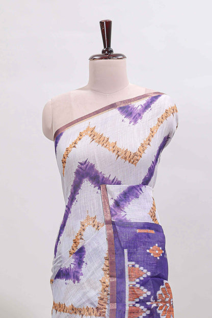 Off white chevron style shibori print linen cotton saree with contrast violet border and ikkat design pallu