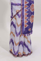 Off white chevron style shibori print linen cotton saree with contrast violet border and ikkat design pallu