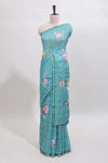 Green checked floral design linen cotton saree with self zari border and printed blouse