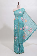 Green checked floral design linen cotton saree with self zari border and printed blouse