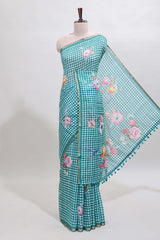 Green checked floral design linen cotton saree with self zari border and printed blouse