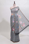 Grey checked floral design linen cotton saree with self zari border and printed blouse
