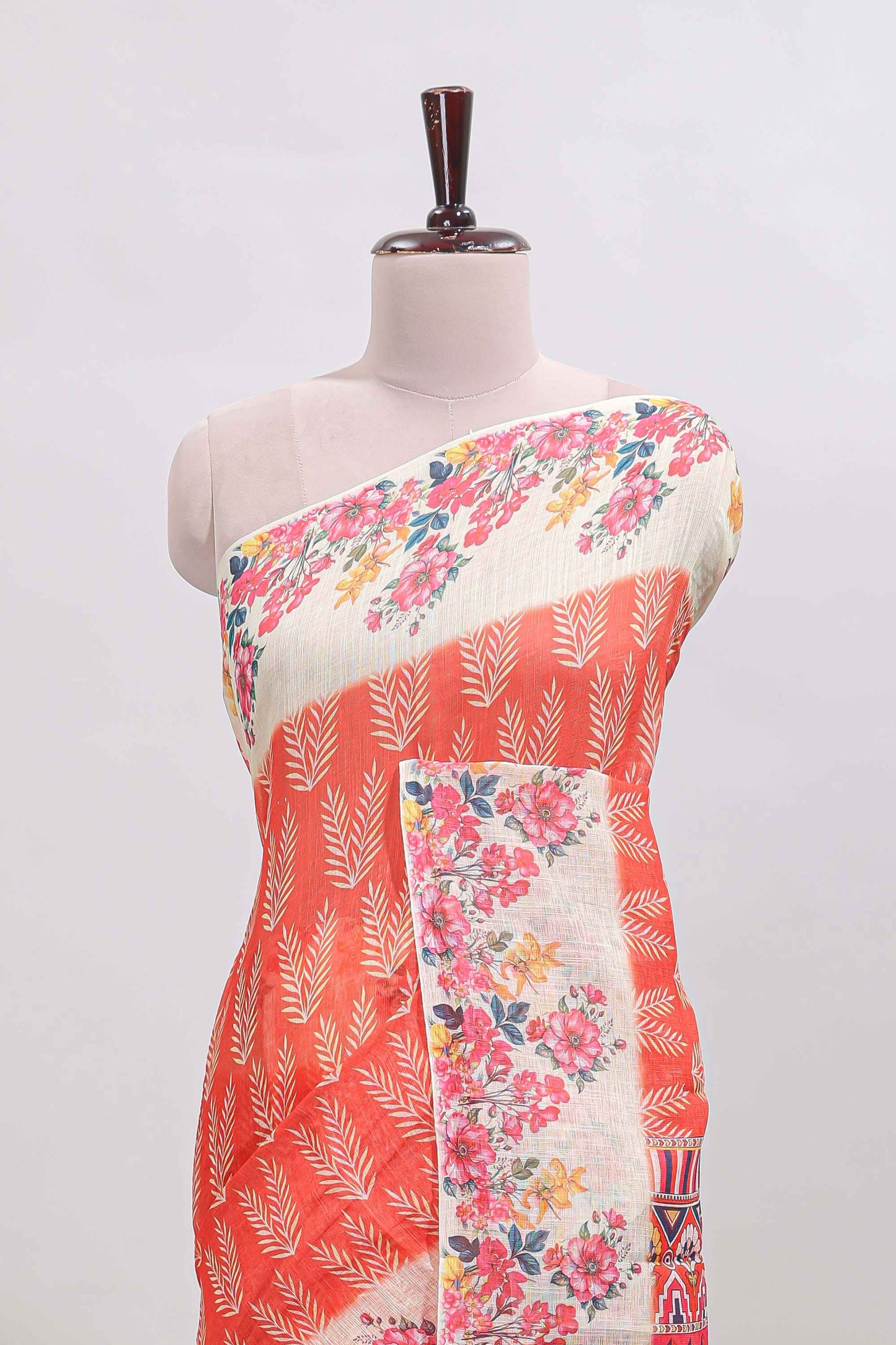 Orange leaf print linen cotton saree with contrast floral design border and matching blouse