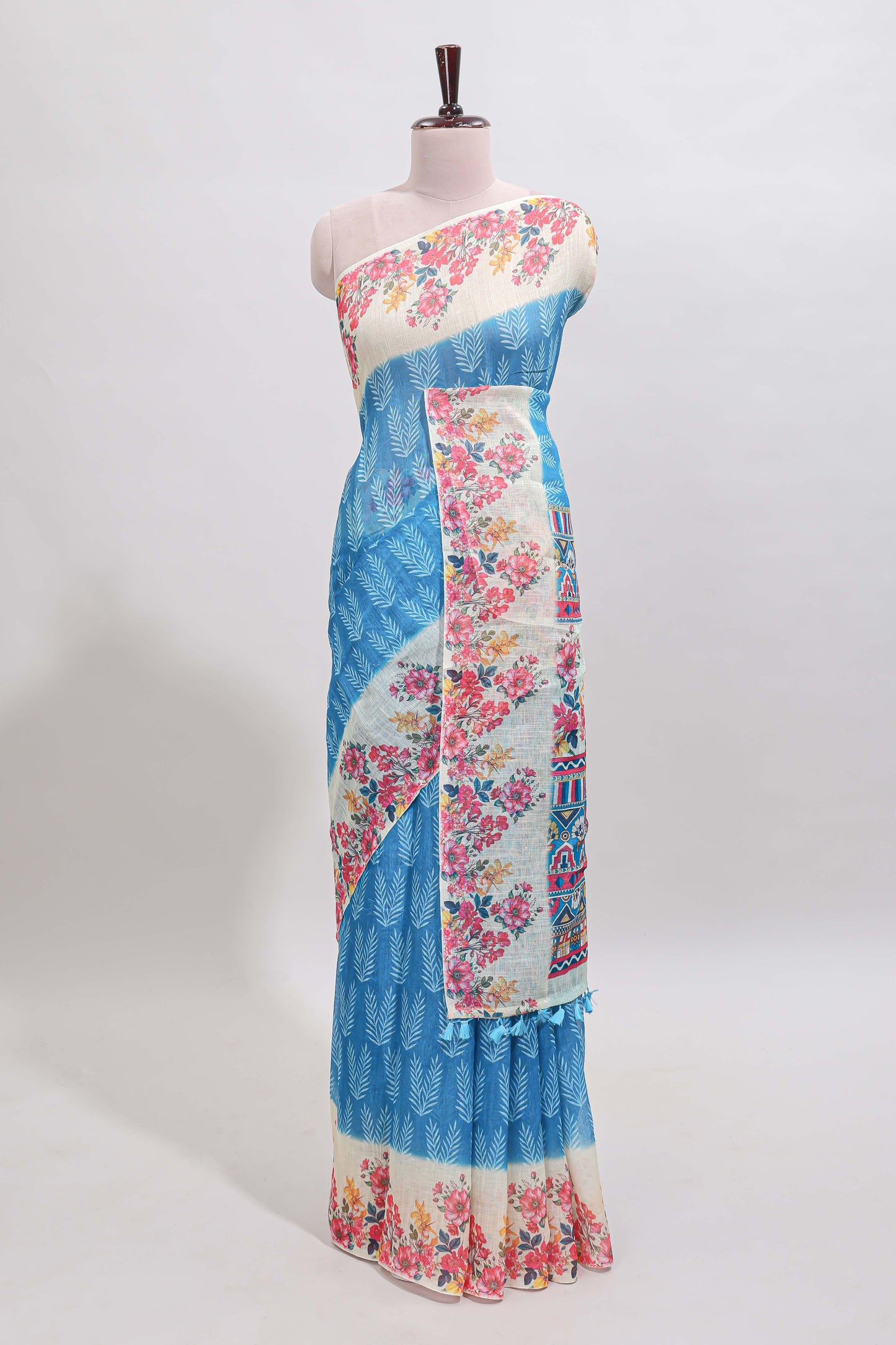 Blue leaf print linen cotton saree with contrast floral design border and matching blouse