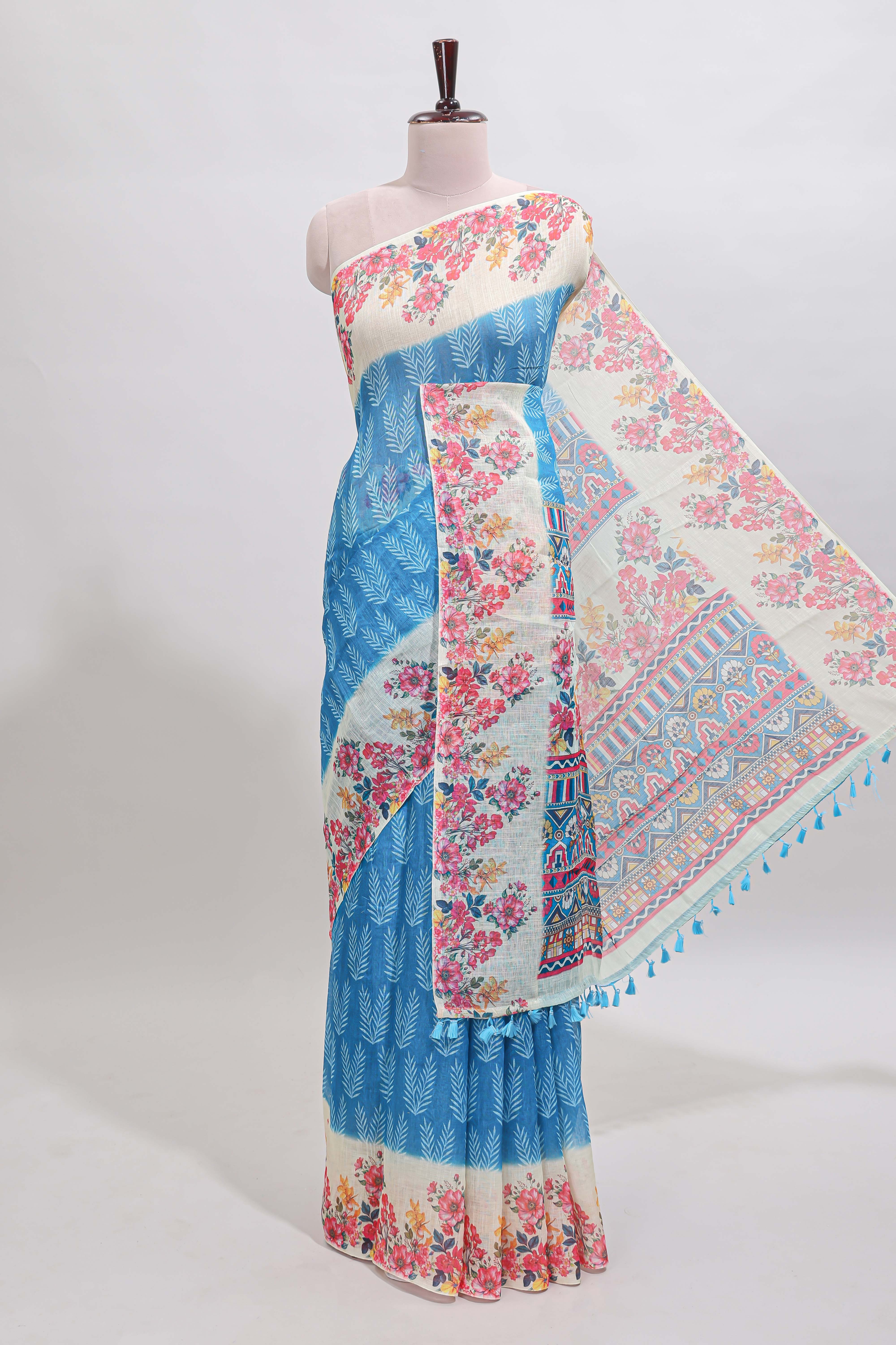 Blue leaf print linen cotton saree with contrast floral design border and matching blouse