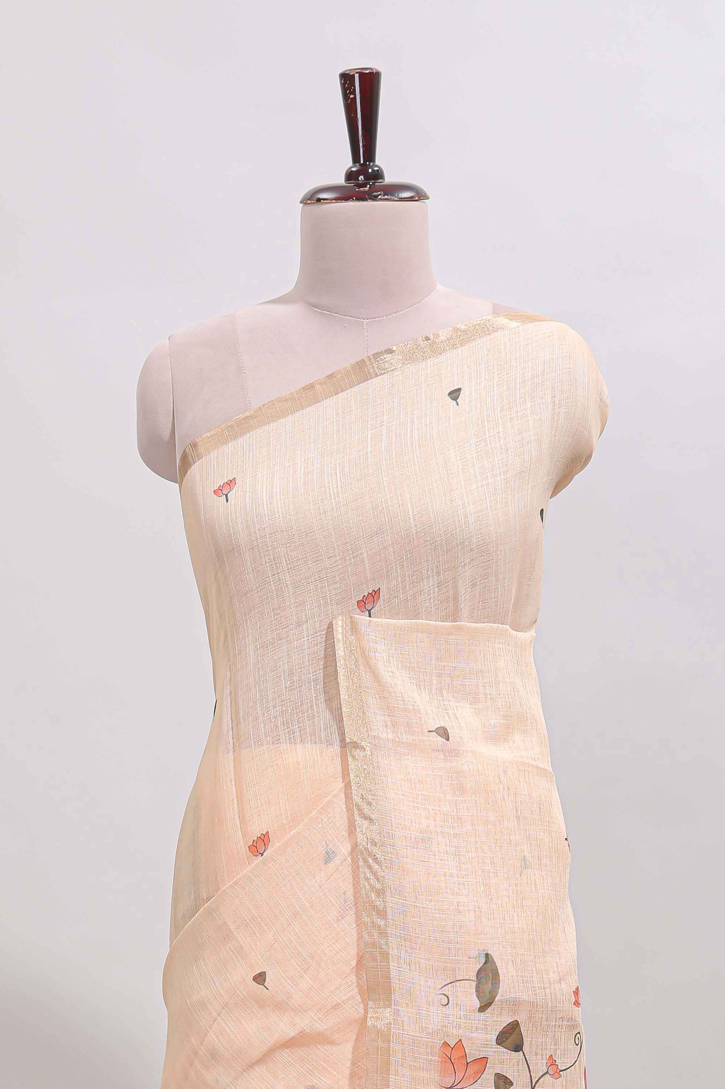 Cream floral design linen cotton saree with self zari border, matching pallu and contrast blouse