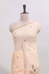 Cream floral design linen cotton saree with self zari border, matching pallu and contrast blouse