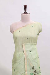Green floral design linen cotton saree with self zari border, matching pallu and contrast blouse