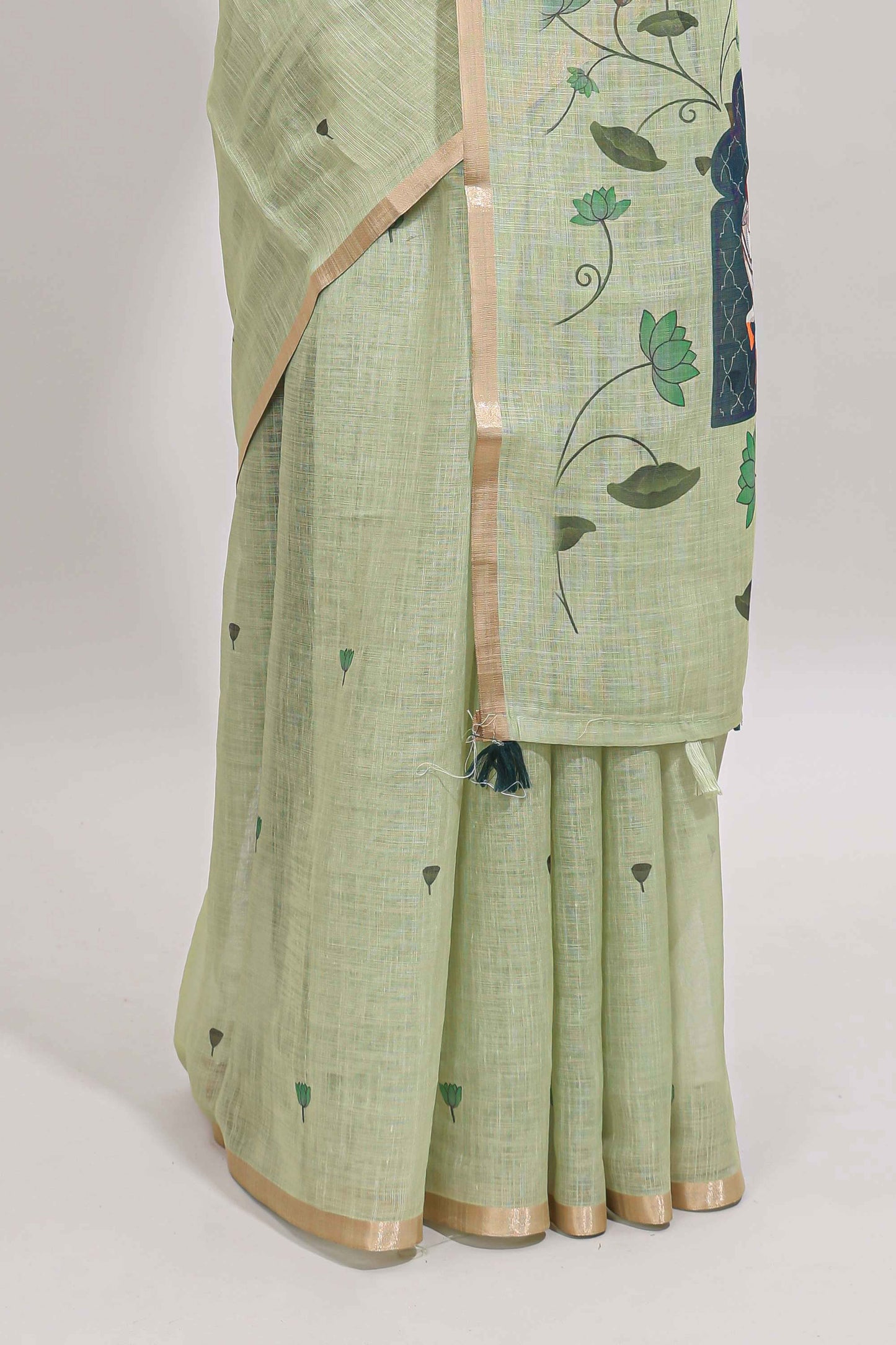 Green floral design linen cotton saree with self zari border, matching pallu and contrast blouse