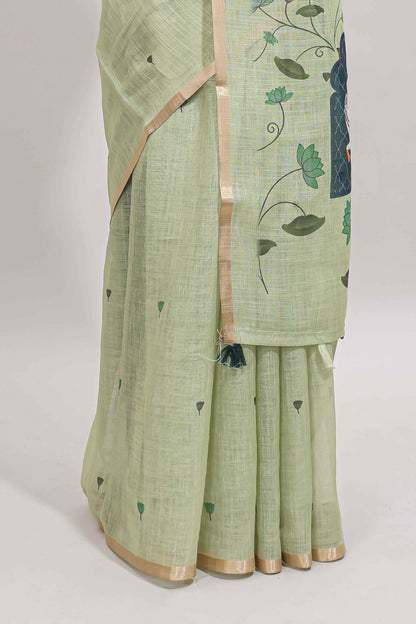 Green floral design linen cotton saree with self zari border, matching pallu and contrast blouse