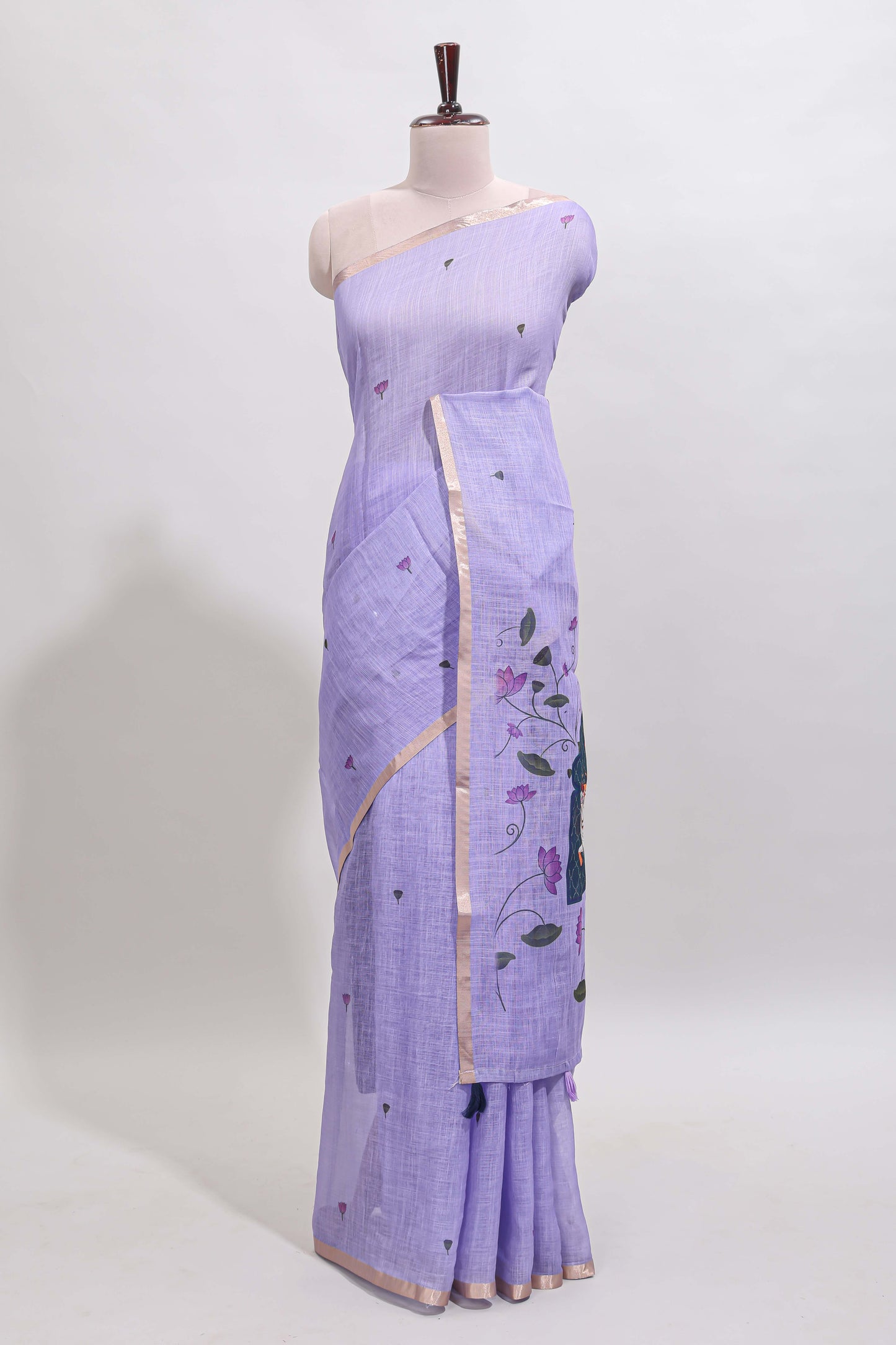 Lavender floral design linen cotton saree with self zari border, matching pallu and contrast blouse