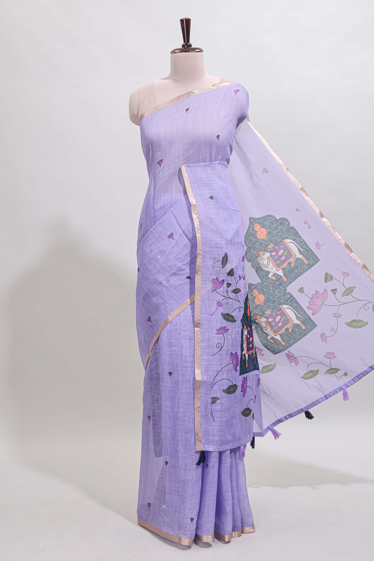 Lavender floral design linen cotton saree with self zari border, matching pallu and contrast blouse